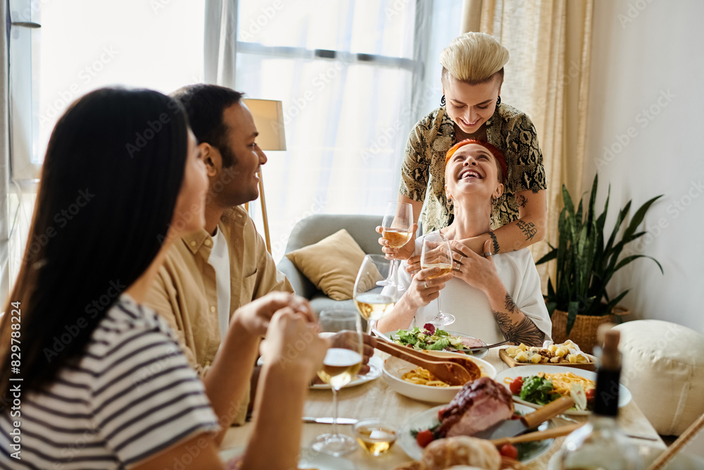 Friends and a loving lesbian couple enjoying a meal together at a table. Friends and a loving lesbian couple enjoying a meal together at a table.