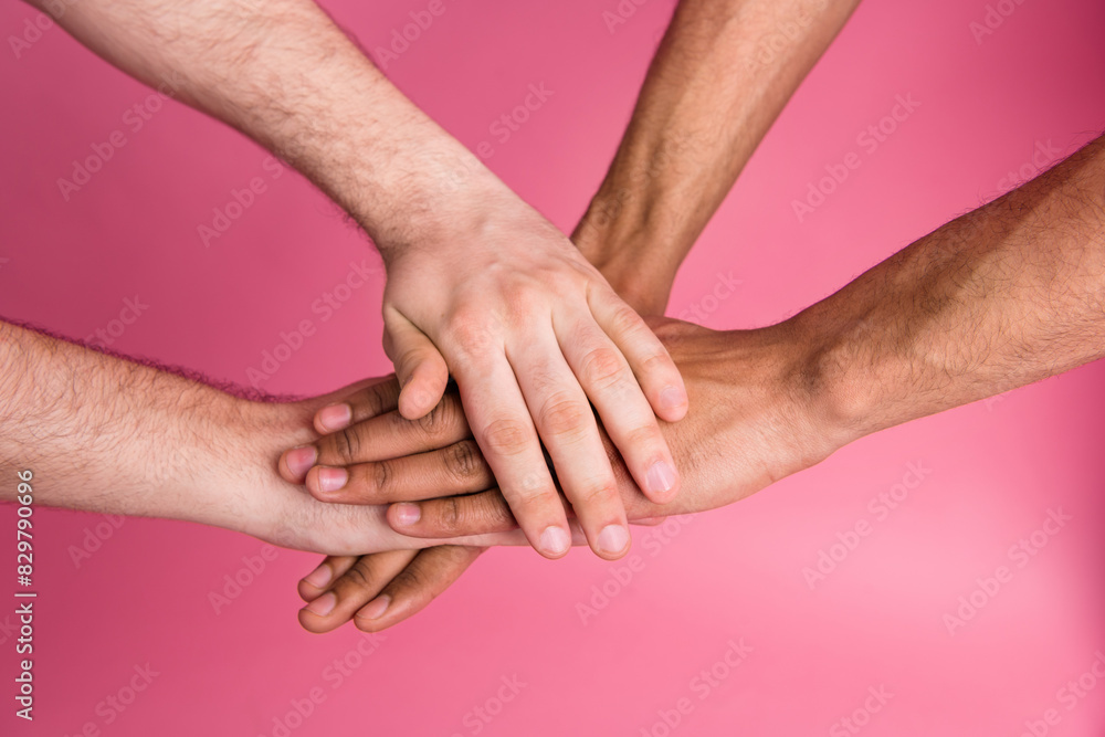 Fototapeta premium Photo of two people put hands together teamwork concept isolated pastel color background