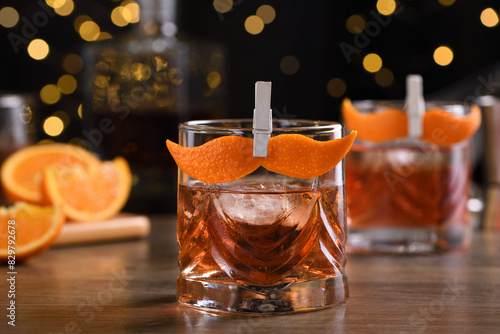 The Sharpie Mustache is a cocktail that's easy to make with equal parts rye whiskey, gin, sweet vermouth and a few drops of bitters, and garnished with a mustache-shaped orange zest photo