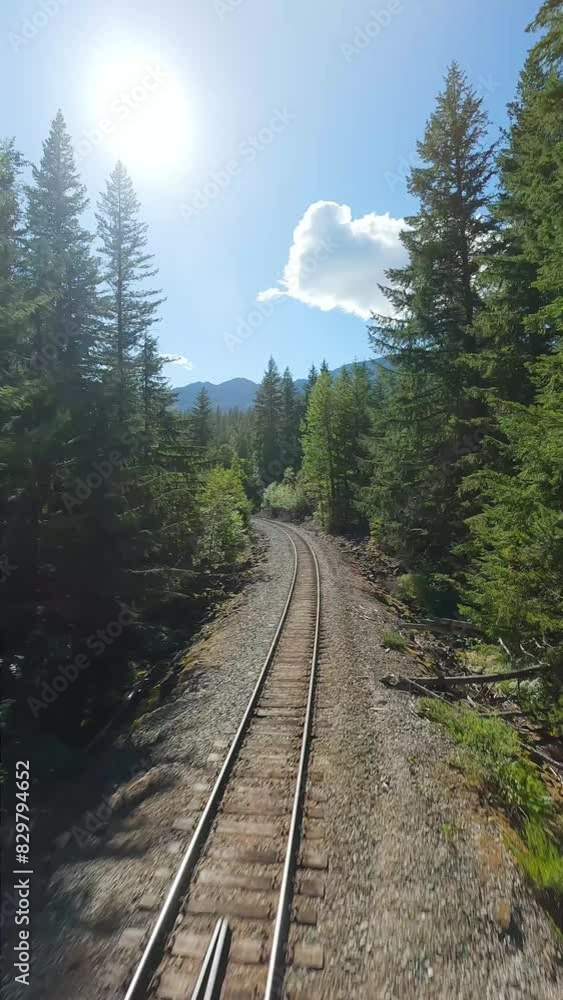 FPV drone is flying fast forward over railway track. Canada FPV drone is flying fast forward over railway track. Canada