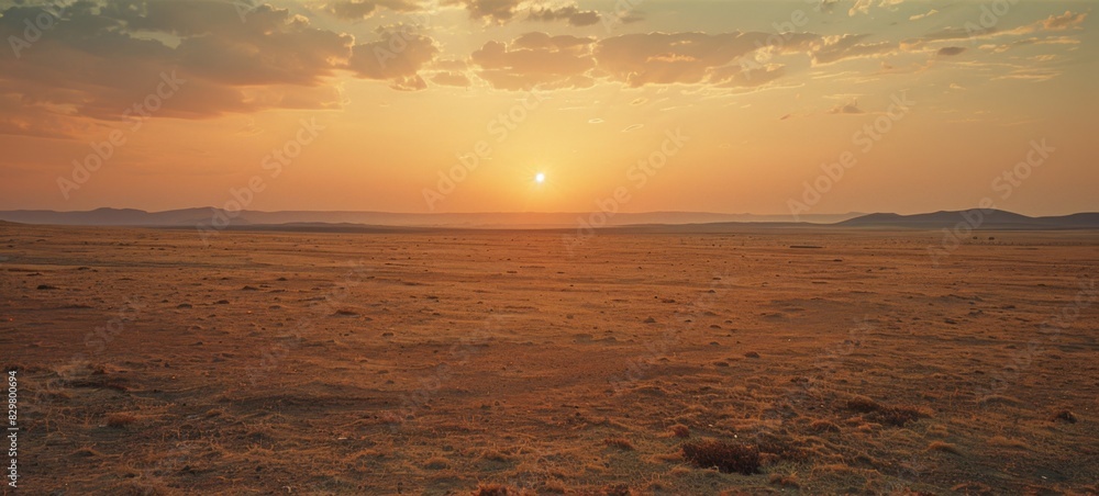 Fototapeta premium The wide-angle lens captures the horizon landscape in the desert, showcasing the magnificent scenery of the sky, white clouds, and golden sand