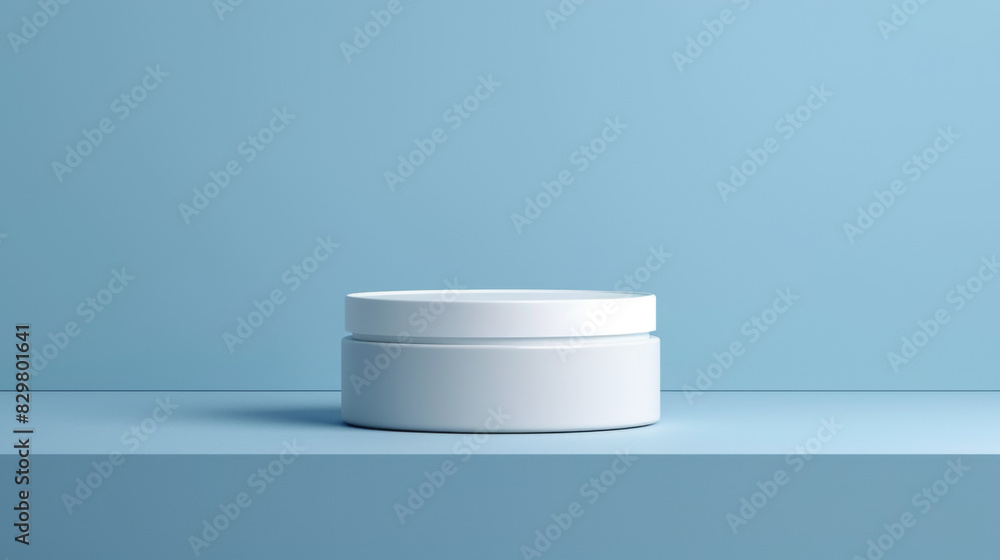 A white jar sits on a blue countertop A white jar sits on a blue countertop