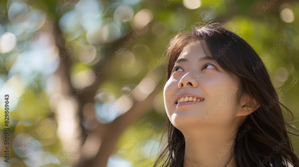 With a contented smile, she gazes upward, feeling the embrace of the gentle breeze against her face. With a contented smile, she gazes upward, feeling the embrace of the gentle breeze against her face.