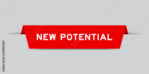 Red color inserted label with word new potential on gray background