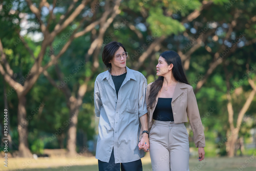 Asian couples playfully bond, sharing affectionate gazes, laughter, and intimate warmth outdoors. Asian couples playfully bond, sharing affectionate gazes, laughter, and intimate warmth outdoors.