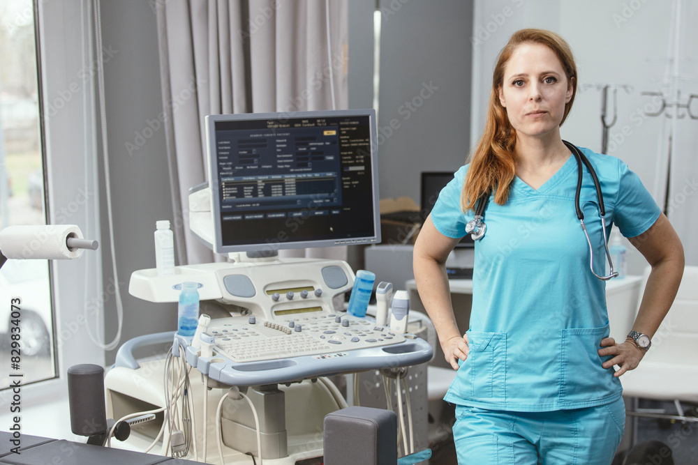 Сardiologist doctor in her office near a medical devices. A rehabilitation doctor in a medical center near modern medical devices waiting for a patient. Professional private clinic. Сardiologist doctor in her office near a medical devices. A rehabilitation doctor in a medical center near modern medical devices waiting for a patient. Professional private clinic.