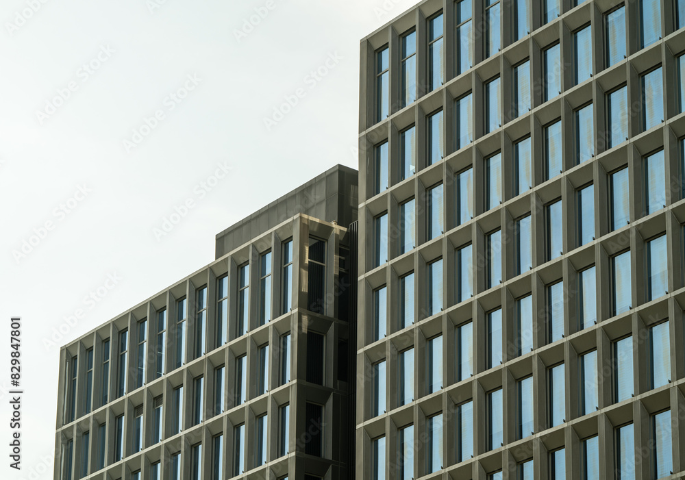 Fototapeta premium Neatly arranged exterior windows of modern buildings.
