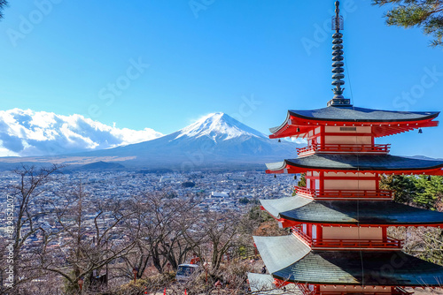 The iconic view of Mount Fuji with the red Chureito pagoda and Fujiyoshida city from Arakurayama sengen park in Yamanashi Prefecture  Japan.