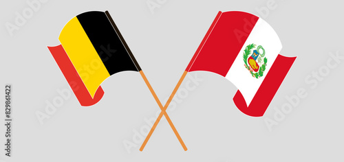 Crossed and waving flags of Belgium and Peru photo