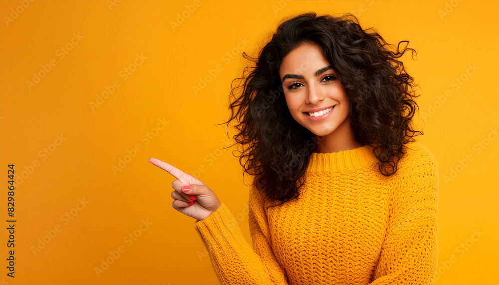 Portrait of a beautiful cute smiling young brunette woman with curly ...