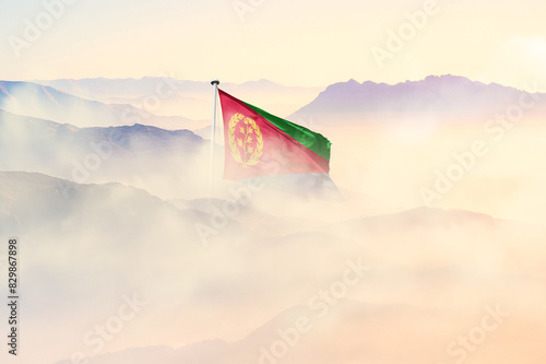 Eritrea flag disappears in beautiful clouds with fog. photo