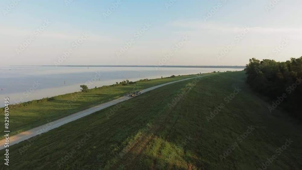 Aerial Shot Of Pick-Up Vehicle Moving With Boat On Road By Tranquil Bayou, Drone Flying Forward Over Green Landscape - Bayou Vista, Texas Aerial Shot Of Pick-Up Vehicle Moving With Boat On Road By Tranquil Bayou, Drone Flying Forward Over Green Landscape - Bayou Vista, Texas