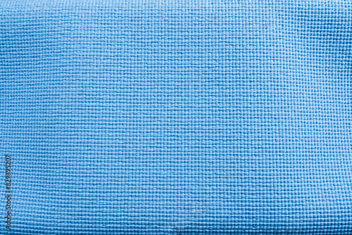 Blue fabric texture background with a grid pattern and light blue squares