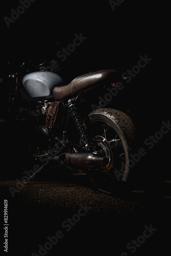 Photo of a classic motorcycle on a black background