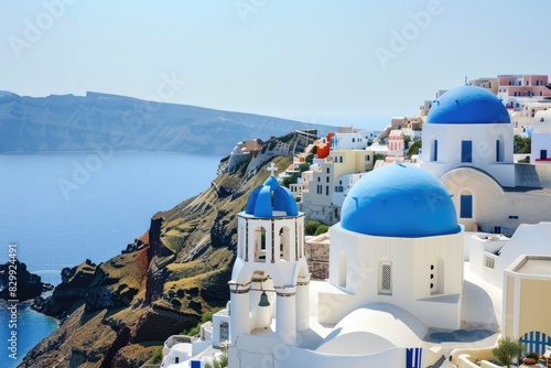 a view of a blue domed building on a cliff  A pristine Greek island village with whitewashed houses and blue-domed churches