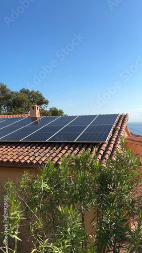 Solar batteries, cell panels or solar electric panels is installed on roof of house in Europe. Photovoltaic Solar array system for producing clean ecological electricity. Renewable energy concept