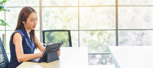 businesswoman working on laptop computer at office. financial stock exchange marketing concept.	