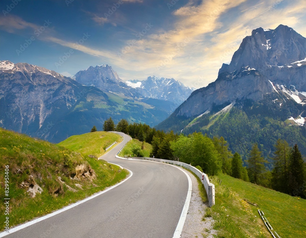 transport road in the Alps against the backdrop of snow-capped mountains and forest
