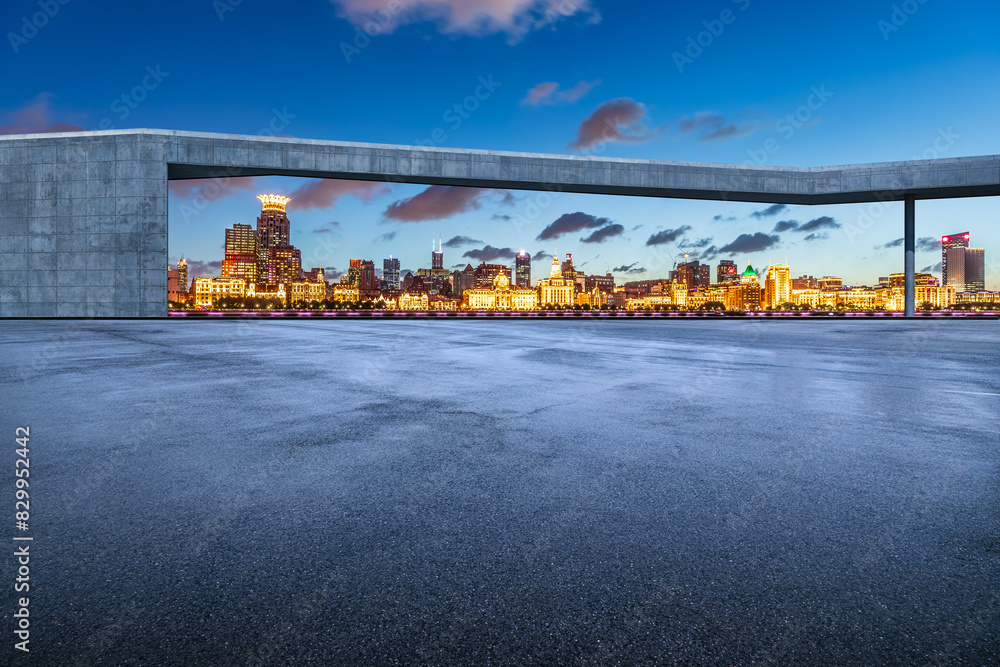 Obraz premium Asphalt road square and city skyline with modern buildings at night in Shanghai
