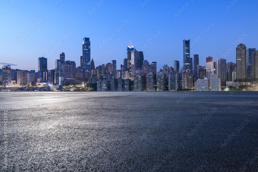 Asphalt road square and modern city buildings at night Asphalt road square and modern city buildings at night