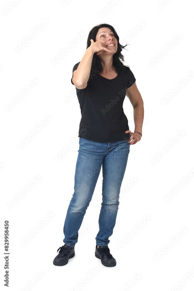 view of happy woman making phone gesture and face expression look up on white background view of happy woman making phone gesture and face expression look up on white background