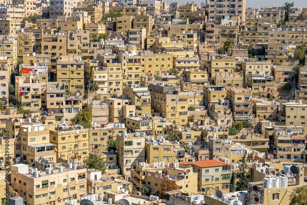 Dense Urban Landscape of Amman, Jordan: Aerial View of Residential Buildings and City Life Dense Urban Landscape of Amman, Jordan: Aerial View of Residential Buildings and City Life
