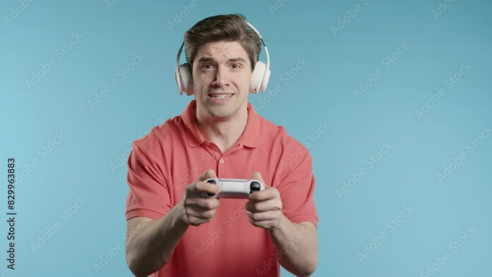 Mature 30s man playing online video game on console TV with joystick. e-sport Mature 30s man playing online video game on console TV with joystick. e-sport