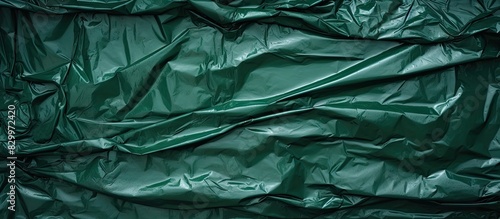 Green recycled truck tarpaulin texture perfect as a background for a copy space image