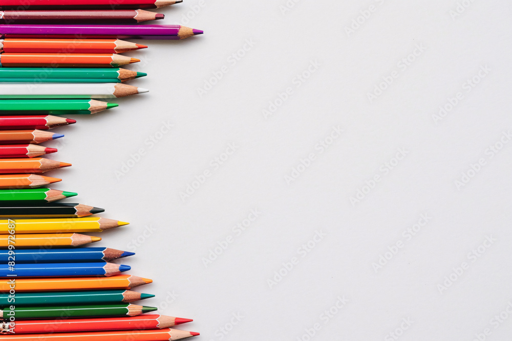 top view of colorful pencils on white background top view of colorful pencils on white background