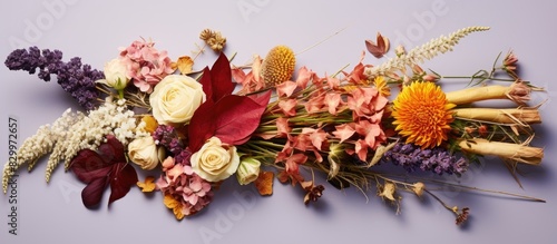 A mix of various dried flower species arranged in a bouquet with empty space for copy in the image