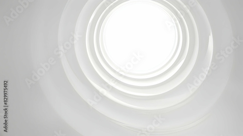 Abstract image featuring white circular layers with soft lighting, creating a clean and elegant geometric design. The concentric pattern adds depth and modernity