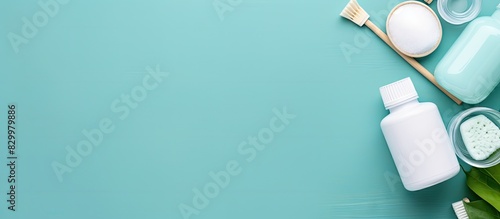 A flat lay image with copy space featuring mouthwash and other oral hygiene products on a colored table The image represents dental hygiene and oral care with a dentist concept
