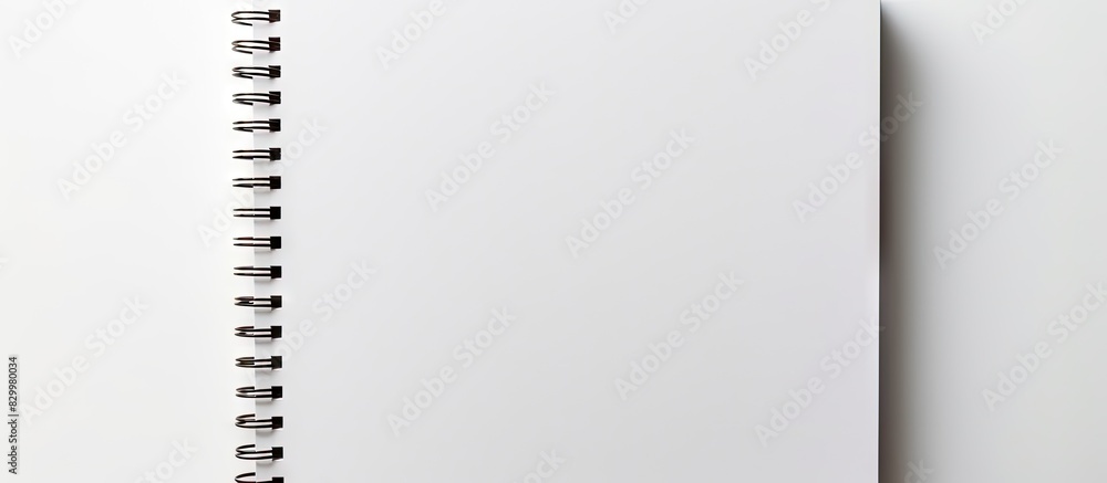 Isolated on a white background there is a piece of blank notebook paper that provides ample space for design Isolated on a white background there is a piece of blank notebook paper that provides ample space for design