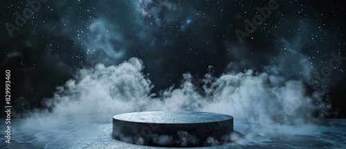 The dark blue background and white fog create a mysterious atmosphere. The round stage in the center is waiting for someone to step on it. photo