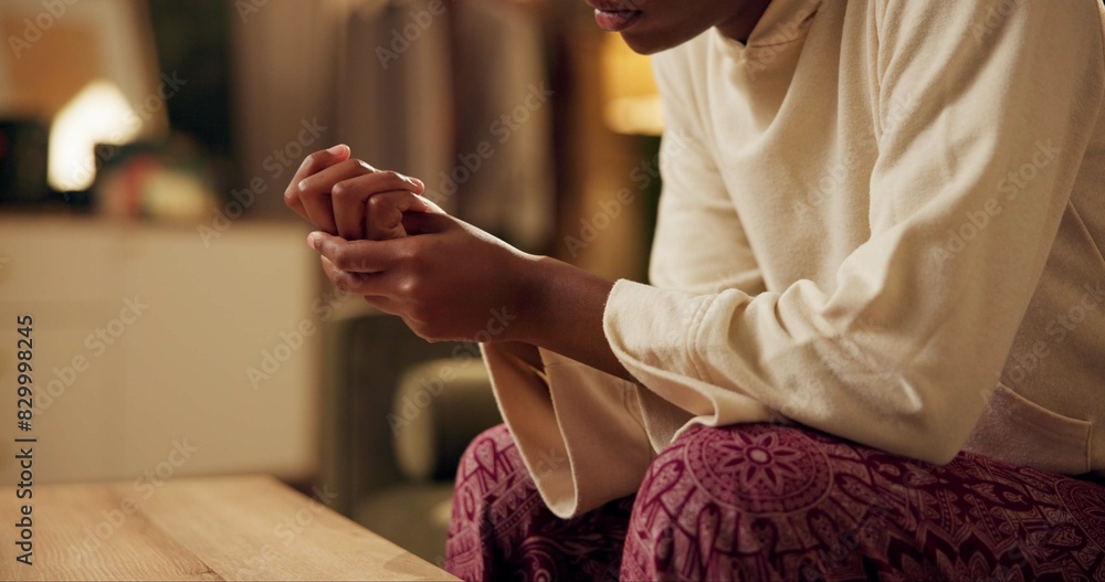 Obraz premium Black girl, hands and worry with stress on sofa for student loans or academic pressure, anxiety and depression. Woman, home and burnout on couch for fear of bad news or mistake, nervous and scared.