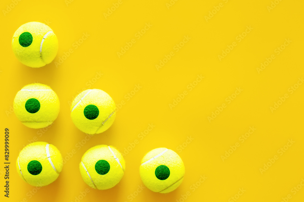 Fototapeta premium Set of green tennis balls, top view. Sport games background