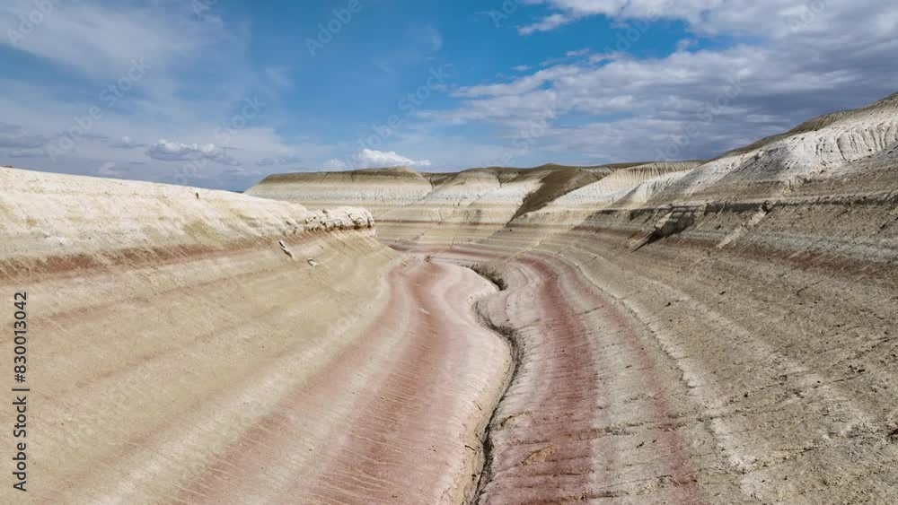 The tract Kyzylkup or «Mangistau Tiramisu», is a smooth low layered hills, which resemble the Italian multilayer dessert «Tiramisu». Kazakhstan, Mangystau Region. The tract Kyzylkup or «Mangistau Tiramisu», is a smooth low layered hills, which resemble the Italian multilayer dessert «Tiramisu». Kazakhstan, Mangystau Region.