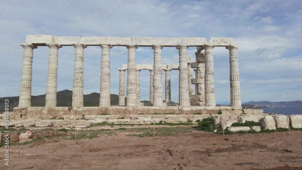 Temple of Poseidon is one of the most famous monuments in Greece , perched on a rocky promontory overlooking the Egean Mediterranean sea , Cape Sounion - drone aerial view of Unesco Heritage world Temple of Poseidon is one of the most famous monuments in Greece , perched on a rocky promontory overlooking the Egean Mediterranean sea , Cape Sounion - drone aerial view of Unesco Heritage world