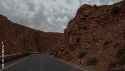Pov driving trip downhill on winding mountain road in the Dades Gorge, Morocco