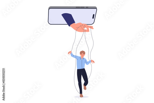 Manipulation of person using social networks and applications in mobile phone, with hand controlling man like puppet. Problems of digital manipulation and disinformation or propaganda on internet