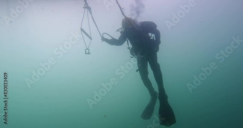 Commercial diver rigs equipment underwater closeup