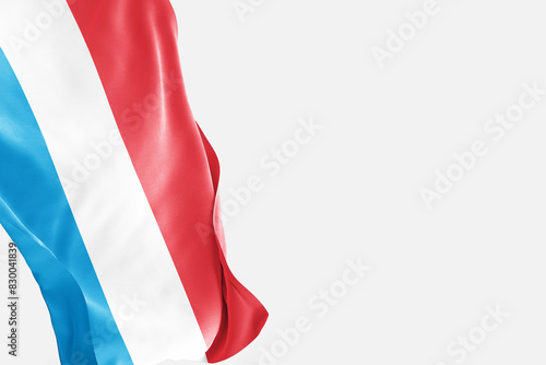 National flag of Luxembourg flutters in the wind. Wavy Luxembourg Flag. Close-up front view.