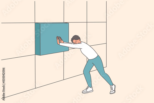 Strong business man installing missing block in wall, building reliable company or startup