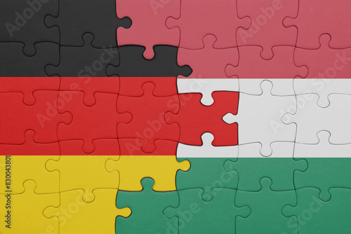 puzzle with the colourful national flag of hungary and flag of germany.