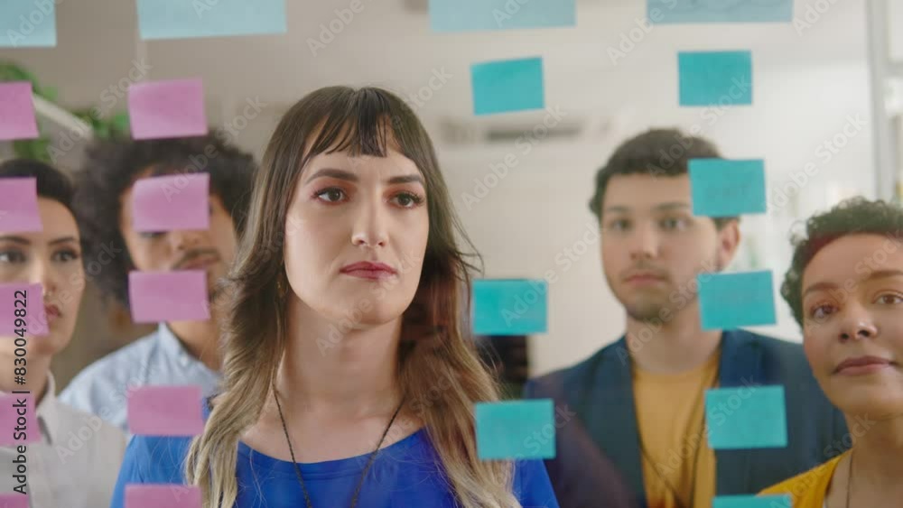 Close up of Creative transgender business woman collaborating and thinking at meeting in coworking office. Close up of Creative transgender business woman collaborating and thinking at meeting in coworking office.