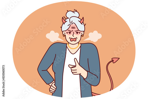 Elderly woman with horns and devil tail screams and points with finger, scolding and threatening opponent. Gray-haired woman pensioner in image of devil feels hatred for concept of senile aggression