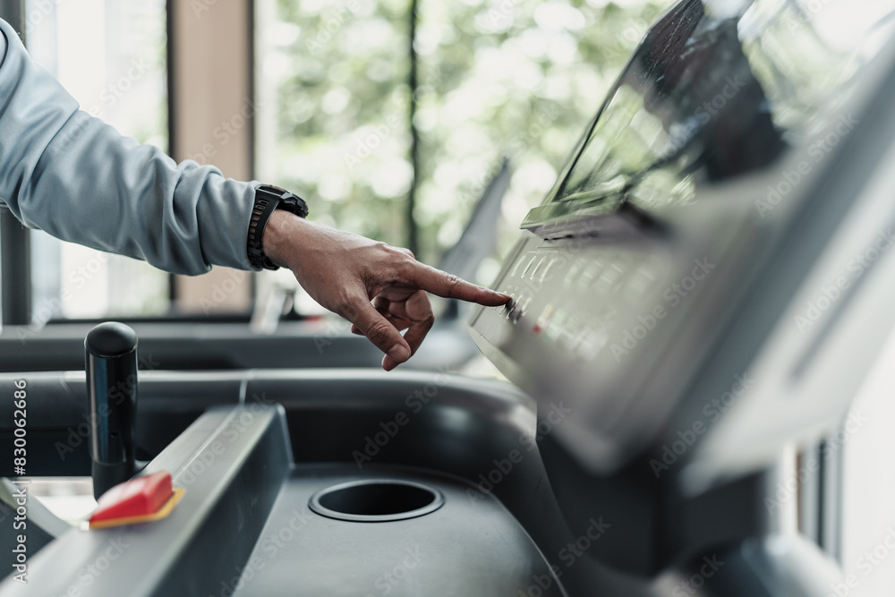 finger press botton running treadmill at gym for cardio. Fitness workout concept. finger press botton running treadmill at gym for cardio. Fitness workout concept.