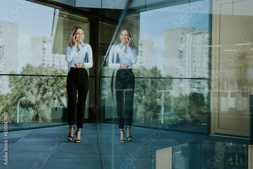 Professional woman standing...