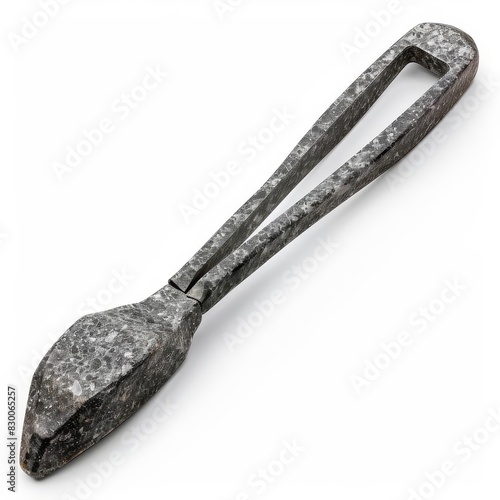 Obraz na płótnie Granite tongs with a rough, textured handle, isolated solid white background