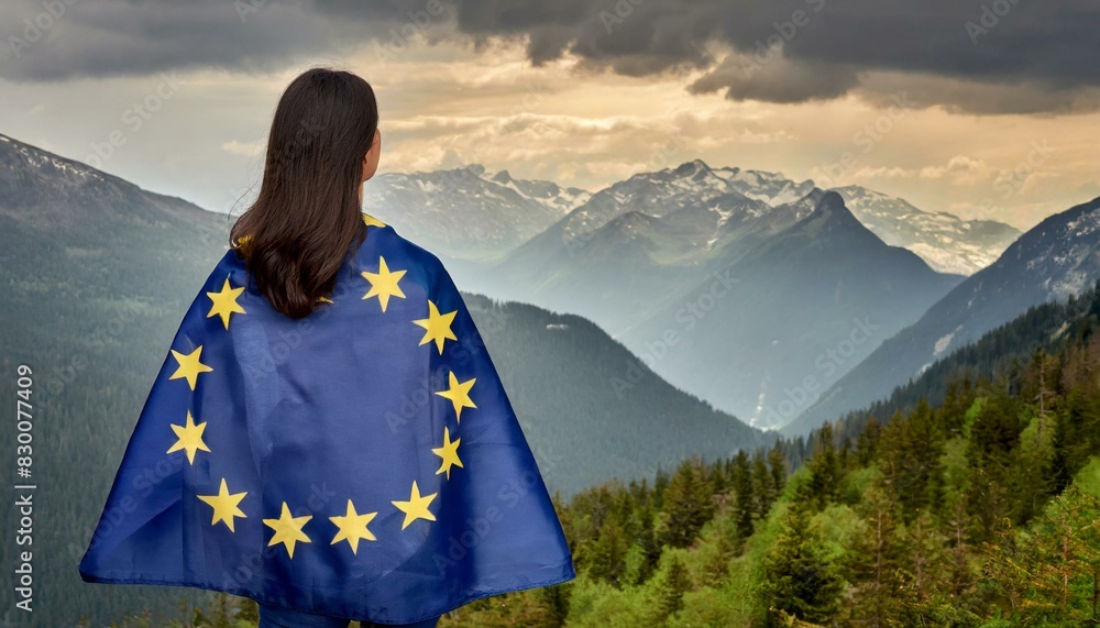 Fototapeta premium woman stands backwards with european flag on shoulders